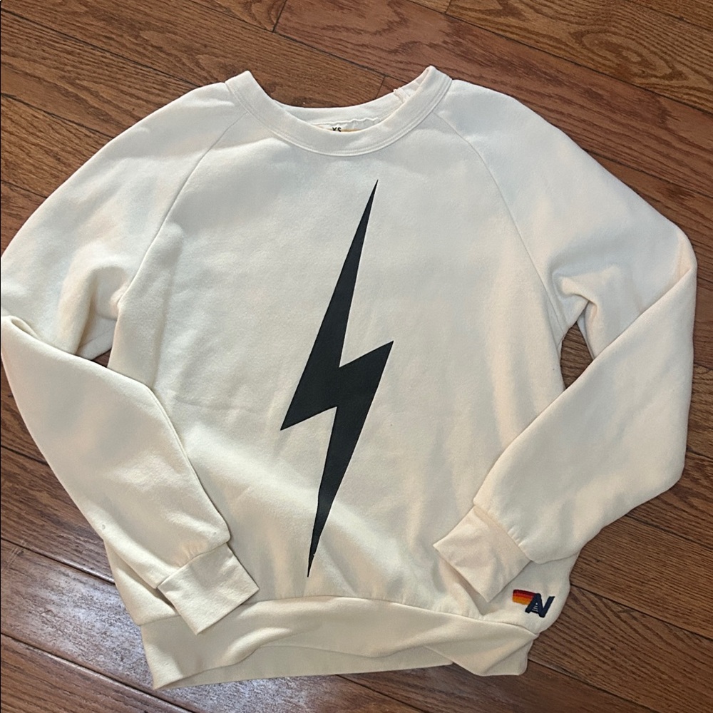 Aviator Nation Cream Sweater with Black Lightning Bolt